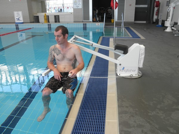 Man using a pool hoist